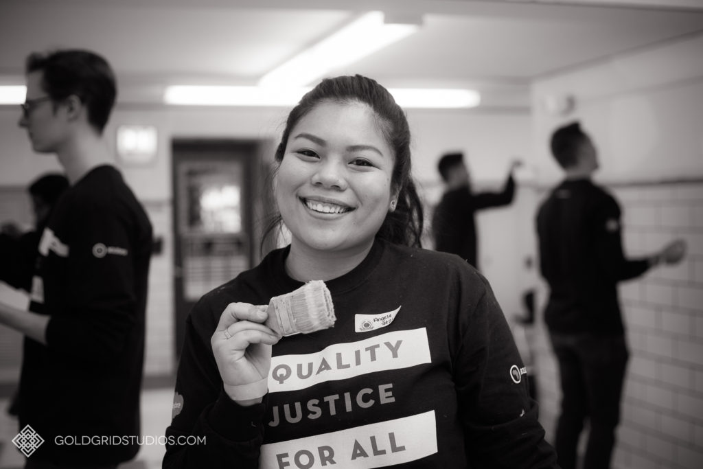 A Salesforce team member smiles during her community service work at Deneen Elementary School in Chicago.